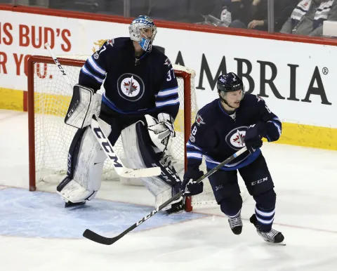 Connor Hellebuyck & Jacob Trouba